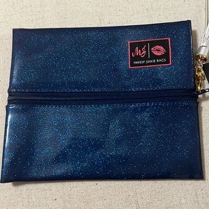 Glitter indigo makeup junkie bag. Size Small.  New with tag